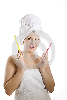 Young healthy woman with two tooth brushes