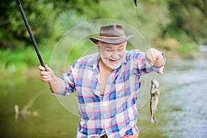 Young At Heart. sport activity and hobby. Trout bait. summer weekend. fisherman with fishing rod. retired bearded fisher