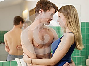 Young heterosexual couple in bathroom