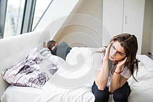 Young heterosexual couple in bedroom