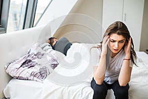 Young heterosexual couple in bedroom