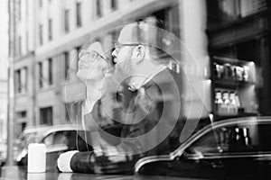 A young heterosexual couple enjoying a conversation at a nyc coffee shop