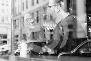 A young heterosexual couple enjoying a conversation at a nyc coffee shop