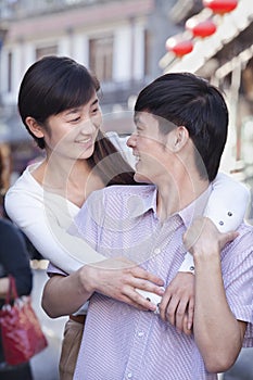 Young Heterosexual Couple Looking at Each Other Outdoors in Beijing