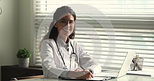 Young high qualified general practitioner female doctor in clinic office