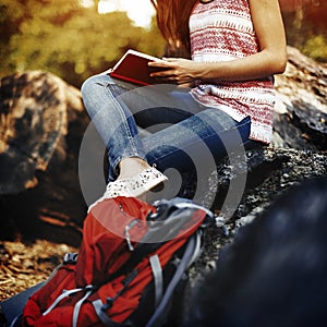 Young Hiker Reading Relaxation Concept