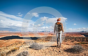 Young hiker with a retro camera in the desert