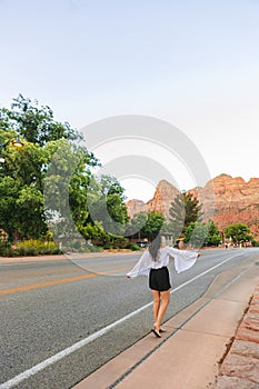 Young hiker woman in Springdale is a quaint town at the entrance of Zion National Park