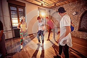 Young hip hop dancers dancing in the studio. Sport, dancing and