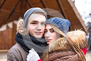 Young hipster couple enjoy in winter city park outdoor