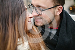 Young hipster couple kissing, hugging in old town