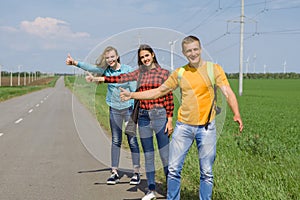 Young hipster friends travel on road