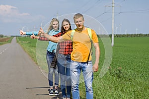 Young hipster friends travel on road