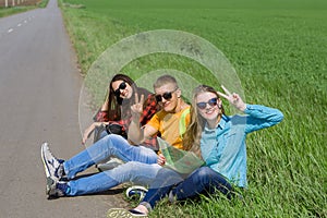 Young hipster friends travel on road