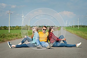 Young hipster friends travel on road