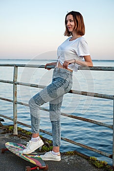 Young hipster girl with longboard