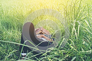 Young hipster man lying down on grassland napping tired after re