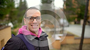 Young hipster man smiling and looking at camera. portrait of attractive young man smiling cheerful confident on seaside