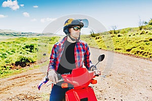 Young hipster rider in helmet enjoying the trip