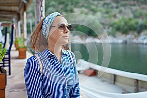 Young hipster woman enjoying sun and good warm day during her recreation time