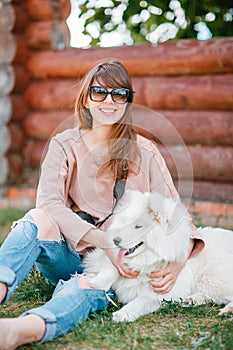 Young hipster woman girl white kid-skin dog ripped jeans