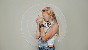 Young hipster woman holding retor insta polaroid camera taking photo portrait