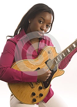 Young hispanic black woman playing electric guitar