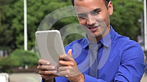 Young Hispanic Business Man Tablet Selfy