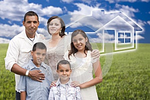 Young Hispanic Family Standing in Grass Field with Ghosted House