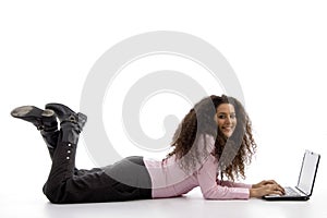 Young hispanic female busy working on laptop