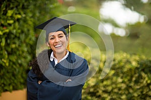 Young hispanic female graduate at her graduation