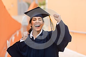 Young hispanic female graduate at her graduation photo