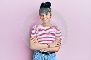 Young hispanic girl wearing casual clothes happy face smiling with crossed arms looking at the camera