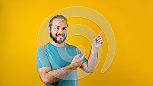 Young hispanic man portrait on yellow background in Mexico Latin America