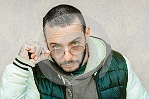 Young hispanic man wearing glasses