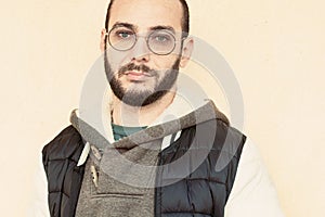 Young hispanic man wearing glasses