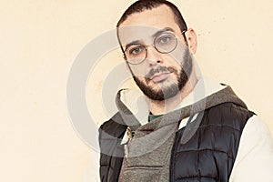 Young hispanic man wearing glasses