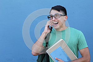 Young Hispanic student happy on the phone