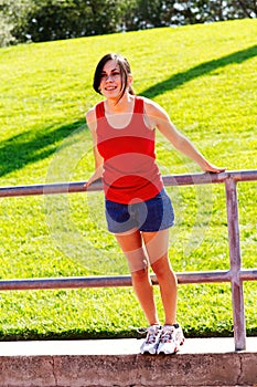 Young Hispanic Teen Woman Red Top Blue Shorts