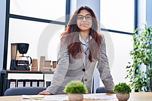 Young hispanic woman business worker smiling confident standing at office