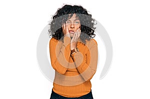 Young hispanic woman wearing casual clothes tired hands covering face, depression and sadness, upset and irritated for problem