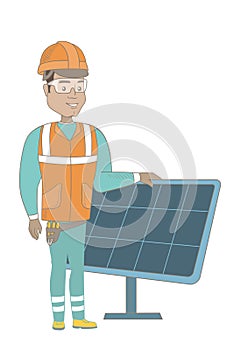 Young hispanic worker of solar power plant