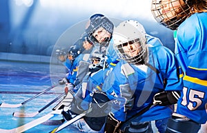 Young hockey defenseman practicing on ice rink