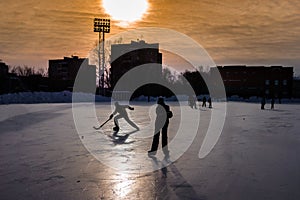 Young hockey player dashing for the ball