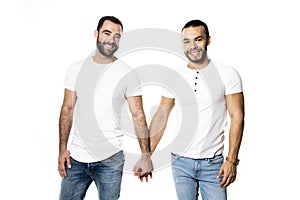 Young homosexuals gay couple love each other on a white background.