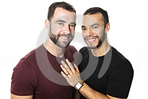 Young homosexuals gay couple love each other on a white background.