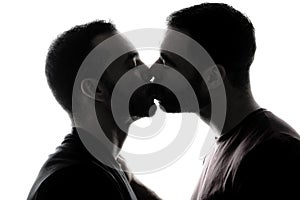 Young homosexuals shadow couple love each other on a white background.