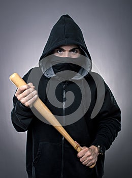 Young hooligan with baseball bat photo