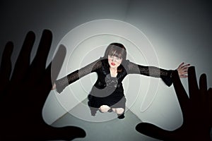 Young horror victim in corner