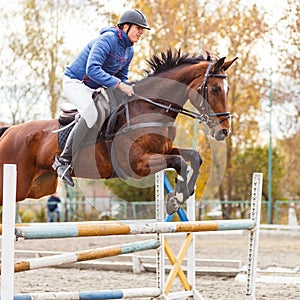 Young horseman on show jumping competition